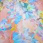 Preview: Stoff Viskose Jersey mit Spring Lotus Blumenmuster Blüten Design pastell multicolor bunt Kleiderstoff Kinderstoff