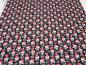 Preview: Stoff Baumwolle Popeline mit Xmas Weihnachts Totenköpfe Skulls mit Weihnachtsmützen Design schwarz rot weiß Kleiderstoff Blusenstoff Dekostoff