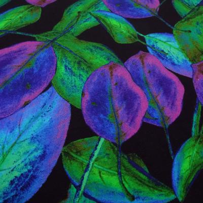 Viscose jersey fabric with “Veil of leaves” design in black green blue purple and fuchsia dress fabric children's fabric