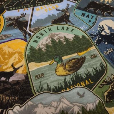 Stoff Baumwolle Sweatshirtstoff Mountain Wildlife Bär Elch Büffel Design grün braun blau gelb bunt Kinderstoff Kleiderstoff