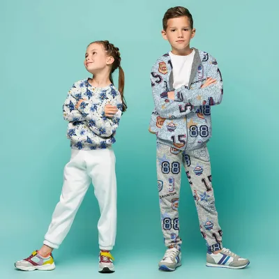 Stoff Sweatshirtstoff Alpenfleece Abseite mit Batik Sterne Design ecrú melange blau goldgelb bunt Kinderstoff Kleiderstoff Hoodiestoff