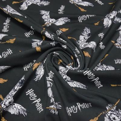 Stoff Baumwolle Jersey Lizenzdruck Harry Potter Eule Hedwig anthrazit braun weiß Kinderstoff Kleiderstoff