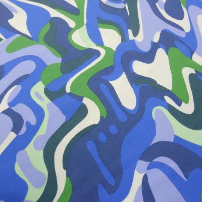 Stoff Baumwolle Jersey mit abstrakten grafischen Design hellblau blau grün cremeweiß Kleiderstoff Kinderstoff