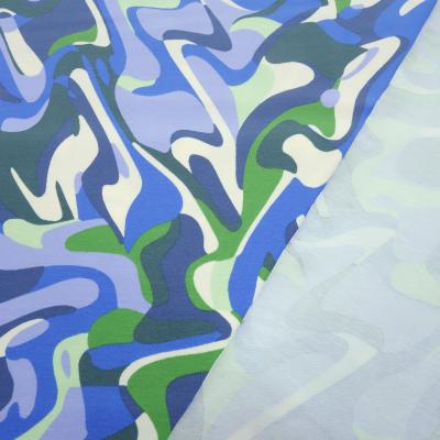 Stoff Baumwolle Jersey mit abstrakten grafischen Design hellblau blau grün cremeweiß Kleiderstoff Kinderstoff