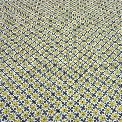 Fabric: cotton poplin with a graphic ornamental pattern flowers in curry yellow, blue, gray, white, and teal; suitable for dresses, children’s clothing, decorative items, and blouses