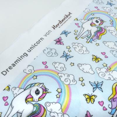 Stoff Baumwolle Jersey "dreaming unicorn" Einhorn Regenbogen Herzen hellblau bunt Kinderstoff Kleiderstoff