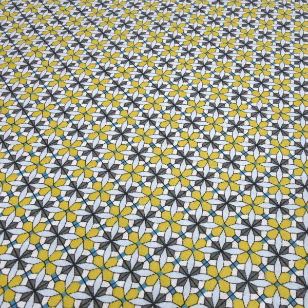 Fabric: cotton poplin with a graphic ornamental pattern flowers in curry yellow, blue, gray, white, and teal; suitable for dresses, children’s clothing, decorative items, and blouses