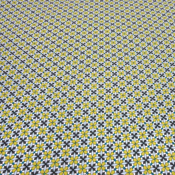 Fabric: cotton poplin with a graphic ornamental pattern flowers in curry yellow, blue, gray, white, and teal; suitable for dresses, children’s clothing, decorative items, and blouses
