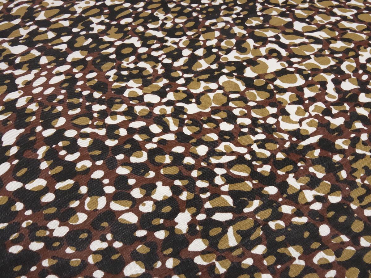 Fabric cotton jersey with animal fur motif leo design brown clay white black dress fabric